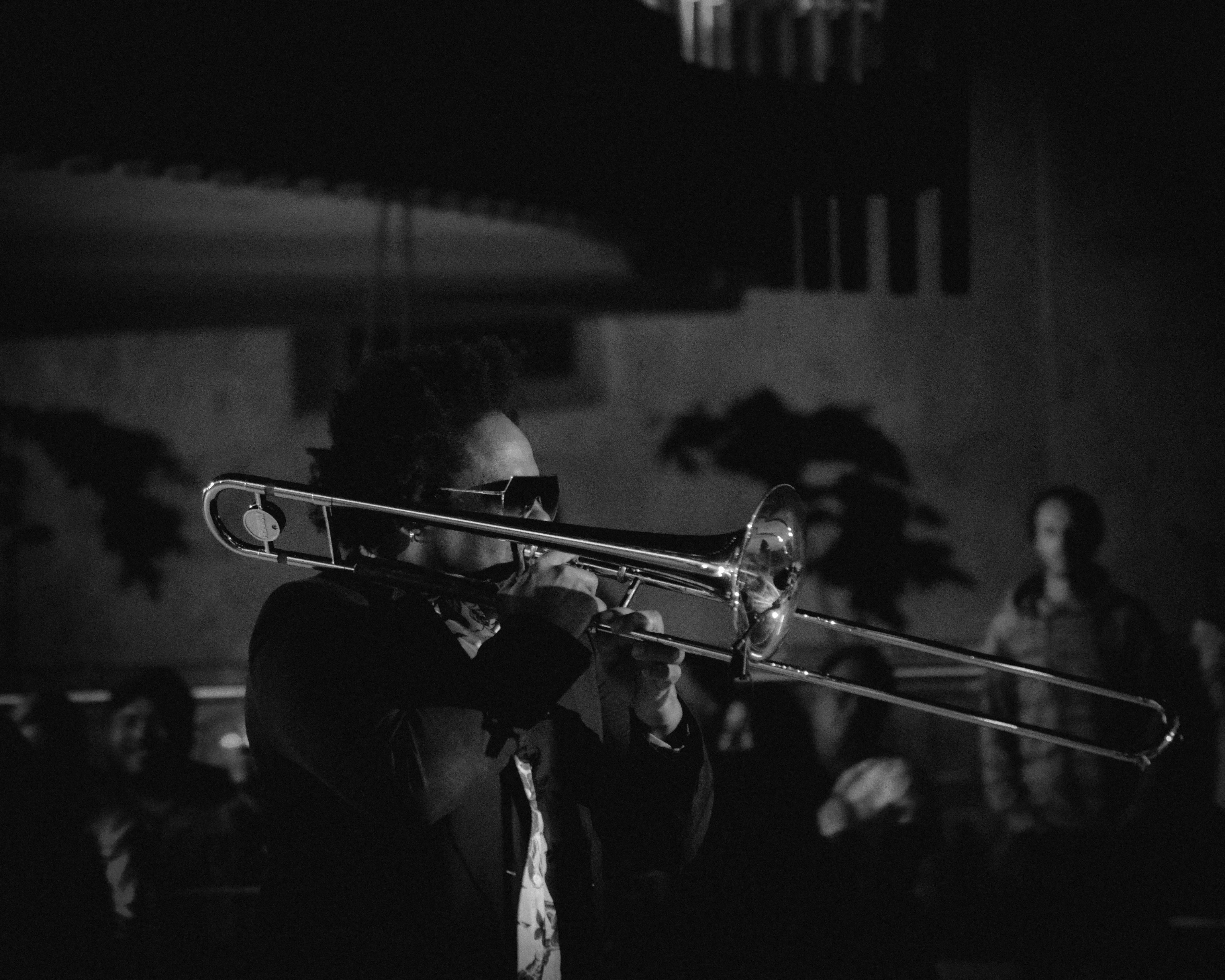 A trombone player with their instrument
