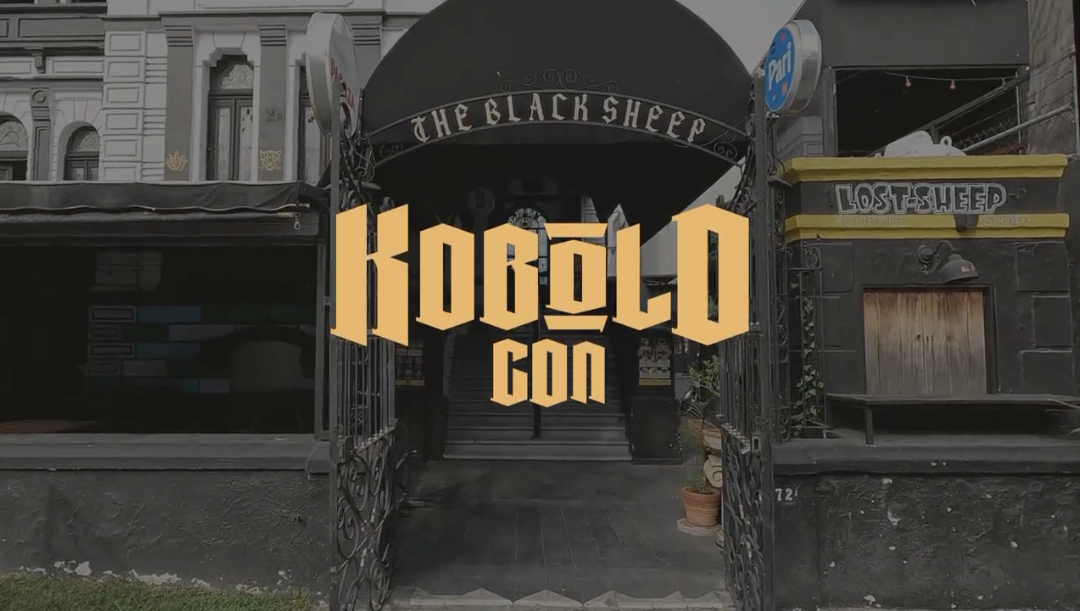 A restaurant entrance with the text KoboldCon over it